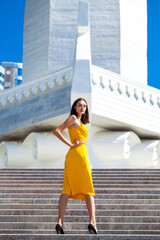 Portrait of a young beautiful woman in summer dress