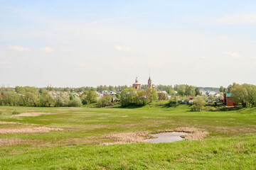 Fototapeta na wymiar Suzdal, Vladimir Oblast/Russia- May 12th, 2012: A view on Suzdal city from the viewing point