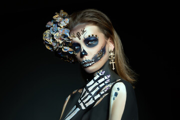 Halloween beauty skeleton woman makeup face. Girl death Halloween costume. Day of The Dead....