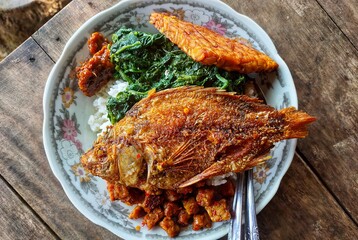 Fish fried with rice on a plate