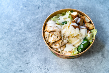 Take Away Healthy Organic Ceaser Salad with Chicken, Parmesan Cheese, Crouton Bread and Yogurt Mayonnaise Sauce.