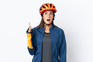 Young cyclist brazilian girl isolated on white  background thinking an idea pointing the finger up