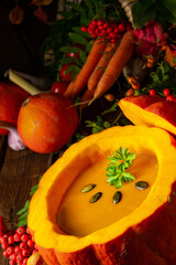 Delicious autumn pumpkin soup with baguette
