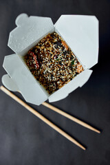 Tasty Udon noodles pasta with tempuru, shrimps wok in box delivery