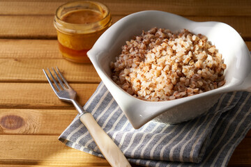 Boiled buckwheat porridge with butter served in a plate