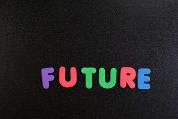  Future word written with colorful foam alphabets on black background children kids school photo