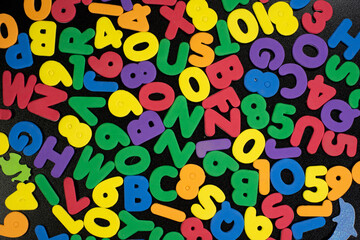 Multi Color Foam Alphabets in a random position children kids colorful background image back to school