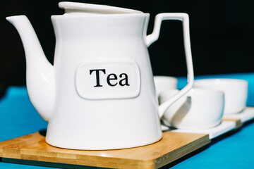 Tea cups set on blue background. Minimalist breakfast photo.