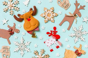 Top view of holiday decorations and toys on blue background. Christmas ornament concept