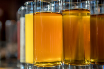 Glasses of fresh juice stand in a row