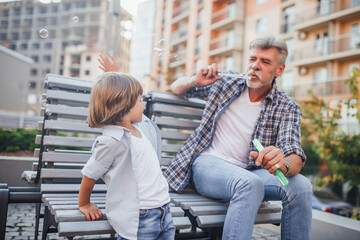 Grandfather with a grandson on a walk