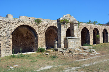 Fototapeta na wymiar Tremiti, Puglia, Italy --The ancient cloister and the well of the abbey of S. Maria al Mare at Tremiti Islands, small islands in the Adriatic Sea, part of the Gargano park