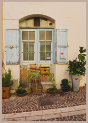 Fototapeta na wymiar External of Mediterranean house, old shutter and flowers