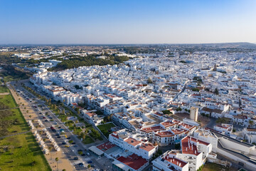 Fototapeta premium Aerial perspective of a spanish white village at the atlantic coast. Conil de la Frontera seen from above.