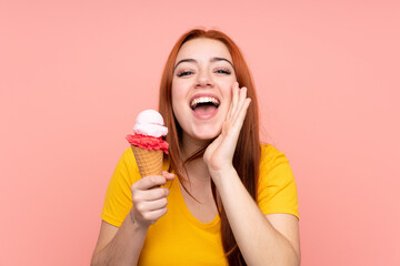 Young girl with a cornet ice cream over isolated background shouting with mouth wide open