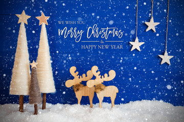 English Calligraphy Merry Christmas And A Happy New Year On Blue Background With Snow. Decoration Like Crhistmas Trees, Moose And Stars And Snowflakes.