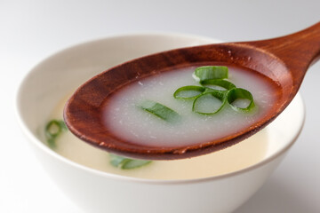 Beef bone broth on white background