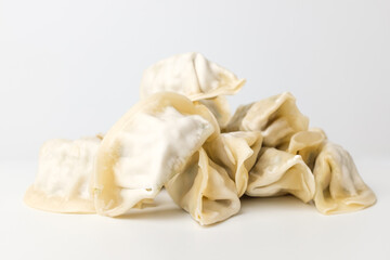Fototapeta na wymiar Frozen dumplings on a white background