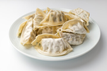Frozen dumplings on a white background