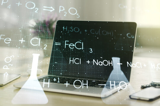 Creative chemistry hologram on modern laptop background, pharmaceutical research concept. Multiexposure