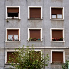 window on the grey facade of the house, architecture in Bilbao city Spain
