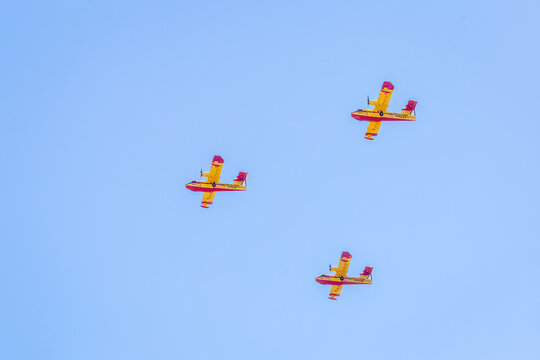 Modern military planes flys in formation through the sky.