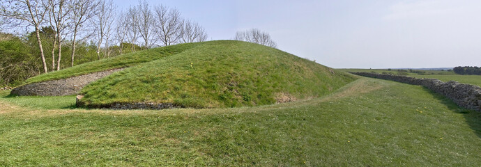 Belas Knap is a neolithic, chambered long barrow situated on Cleeve Hill, near Cheltenham and Winchcombe, in Gloucestershire, England.