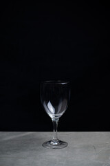 Wine glass on bar in the dark, Lonely in the dark concept.