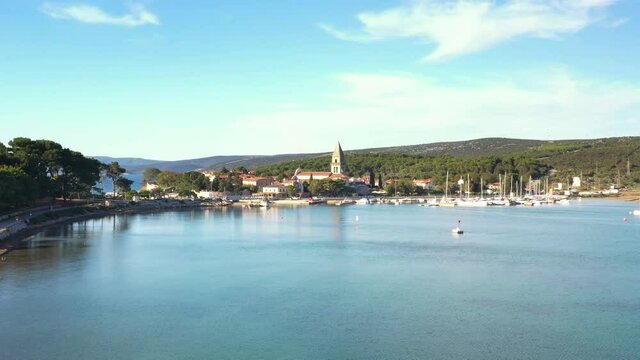 Historic town of Osor with bridge connecting islands Cres and Losinj, Croatia, drone reveal footage
