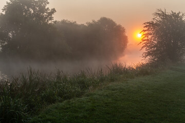 Obraz na płótnie Canvas Sunrise over a River
