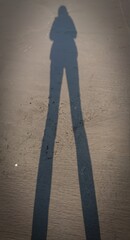 Silhouette of a person walking on the street