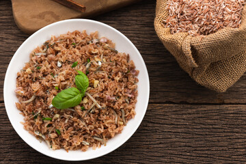 brown rice fire with small fish on wood