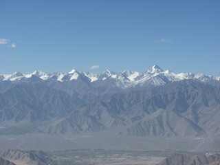 Panoramic View of snowcapped Mountain Range Road In Khardung La (Khardung Pass),  Leh – Ladakh, India.