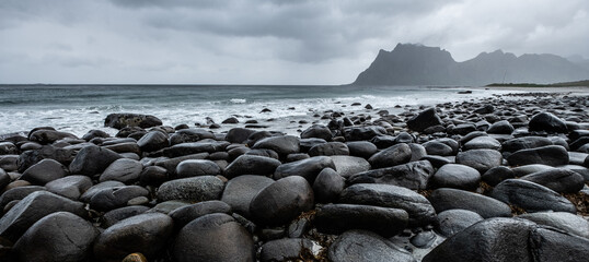 Rocks/stones on the Uttakleiv beach during a rainy day on the Lofoten islands, Norway