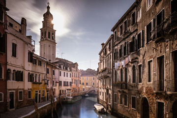 Streets of Venice with a typical waterl canal during a sunny day, Italy