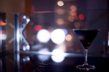 The black drink with bokeh background in the night club in Bangkok Thailand  