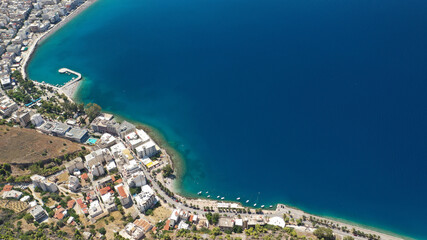 Fototapeta premium Aerial drone photo of famous seaside area, organised beach and bay of Loutraki town, Corinthian bay, Greece