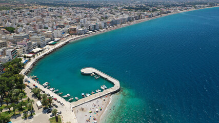 Aerial drone photo of famous seaside area, organised beach and bay of Loutraki town, Corinthian bay, Greece