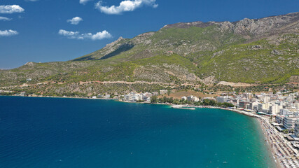 Fototapeta premium Aerial drone photo of famous seaside area, organised beach and bay of Loutraki town, Corinthian bay, Greece