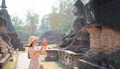 Asian tourists is visiting at Sukhothai in Thailand.Concept Travel