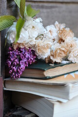 bouquet of flowers and books