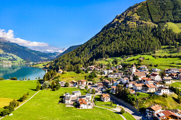 Graun im Vinschgau, a town on Lake Reschen in South Tyrol, Italy - obrazy, fototapety, plakaty