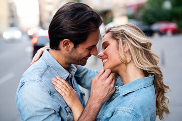 Sweet and affectionate young couple on the street