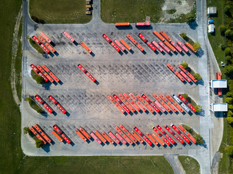 Bus depot red buses topdown view aerial drone shot