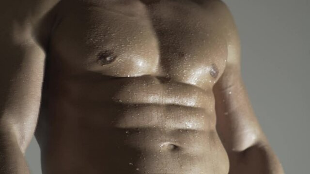 Man with sexy shoulders, abdomen, abs or six pack.