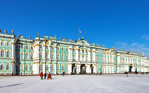 Saint Petersburg on a sunny winter day. Palace Square and the State Hermitage art museum against the blue sky. The main landmark of the city and a place of attraction for tourists