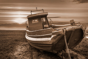 old fishing boat in sepia