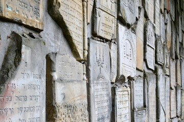 Kazimierz Dolny, Poland. Jewish cemetery with a wailing wall in Czerniawy. The lapidarium, lined with a fragments of historic matzevot, referes to Jerusalem Wailin