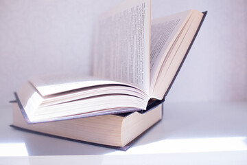 two  interesting books in dark cover on the shelf