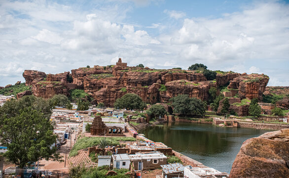 Landscape view of badami templees and caves on red sandstone hills.